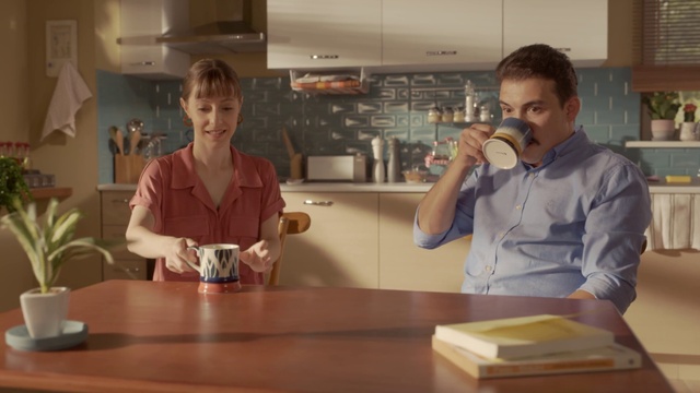 Video Reference: Table, Smile, Drinkware, Tableware, Houseplant, Microphone, Barware, Wood, Countertop, Desk