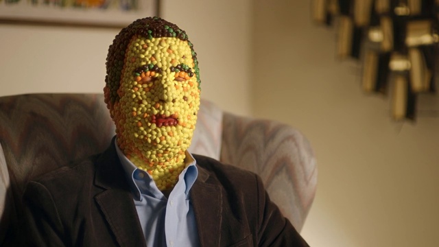 Video Reference: Head, Outerwear, Headgear, Blazer, Suit, Facial hair, Woolen, Room, Event, Beard