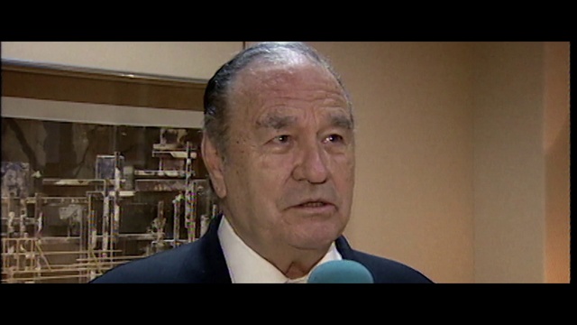 Video Reference: Forehead, Dress shirt, Collar, Wrinkle, Tie, Event, Throat, Official, White-collar worker, Suit