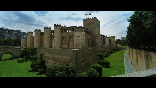 Video Reference: Cloud, Sky, Plant, Building, Natural landscape, Tree, Grass, Landscape, Facade, Medieval architecture