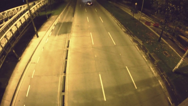 Video Reference: Automotive lighting, Road surface, Asphalt, Wood, Vehicle, Mode of transport, Headlamp, Thoroughfare, Track, Plant