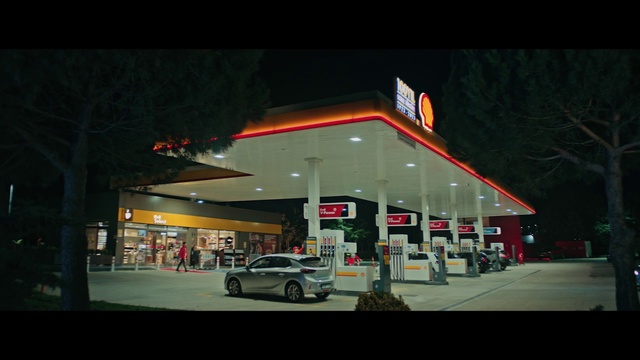 Video Reference: Automotive parking light, Building, Automotive lighting, Filling station, Vehicle, Gasoline, Wheel, Car, Gas pump, Electricity