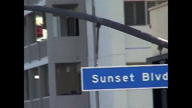 Video Reference: Building, Fixture, Gas, Composite material, Window, Font, Street sign, Metal, City, Signage
