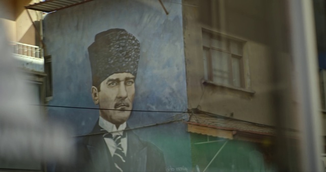 Video Reference: Window, Building, Tie, Art, Sculpture, Facade, Paint, Suit, Visual arts, Mural