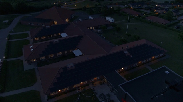 Video Reference: Atmosphere, Building, Road surface, Land lot, Asphalt, Urban design, Dusk, Air travel, Residential area, Landscape