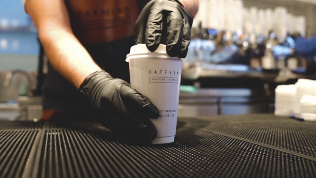 Video Reference: Hand, Gesture, Drink, Finger, Wood, Font, Nail, Audio equipment, Wrist, Alcohol