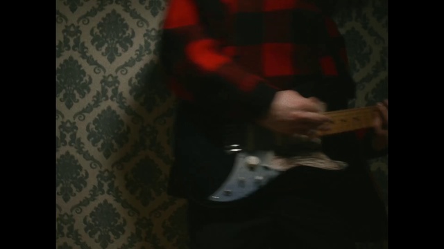 Video Reference: Guitar accessory, Sleeve, Gesture, Grey, Wood, Drum, Elbow, Thigh, Musical instrument, Musical instrument accessory