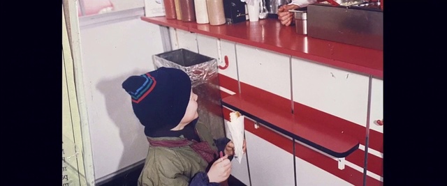 Video Reference: Red, Cap, Baseball cap, Flooring, Shelving, Room, Shelf, Cabinetry, Wood, T-shirt