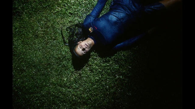 Video Reference: Human body, Flash photography, People in nature, Grass, Thigh, Knee, Automotive lighting, Jacket, Tints and shades, Flooring