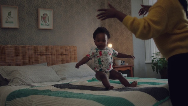 Video Reference: Head, Facial expression, Comfort, Human body, Standing, Gesture, Happy, Living room, Flooring, Toddler