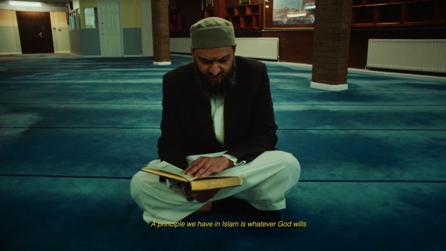 Video Reference: Beard, Flooring, Publication, Leisure, White-collar worker, Sitting, Book, Door, City, Reading