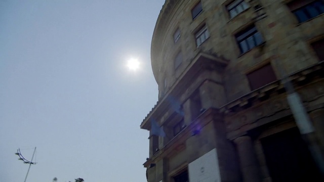 Video Reference: Sky, Building, Atmosphere, Daytime, Window, Lighting, Moon, Facade, City, Space