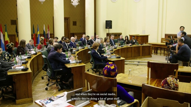 Video Reference: Table, Furniture, Chair, Human, Desk, Event, Government, Youth, Engineering, Suit