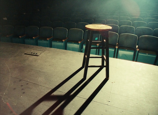 Video Reference: Chair, Lighting, Wood, Rectangle, Line, Flooring, Gas, Tints and shades, Road surface, City