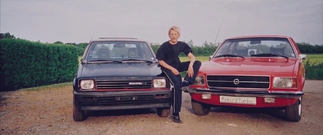 Video Reference: Vehicle, Car, Vehicle registration plate, Automotive parking light, Tire, Motor vehicle, Wheel, Sky, Hood, Plant