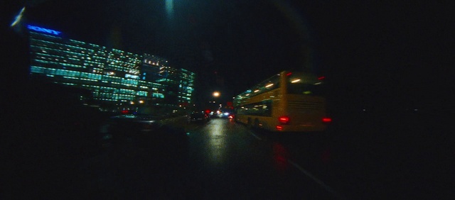 Video Reference: Atmosphere, Automotive lighting, Building, Street light, Electricity, Sky, Mode of transport, Road surface, Asphalt, Headlamp