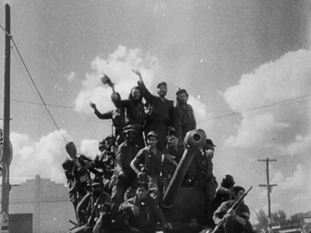 Video Reference: Cloud, Sky, Military person, Pole, Crew, Military organization, Event, Crowd, Flag, Motor vehicle