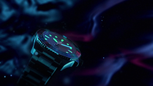 Video Reference: Watch, Analog watch, Flash photography, Clock, Automotive lighting, Watch accessory, Gas, Font, Jewellery, Electric blue