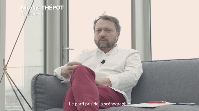 Video Reference: Comfort, Sleeve, Beard, Knee, Event, Sitting, Lap, White-collar worker, Facial hair, Room