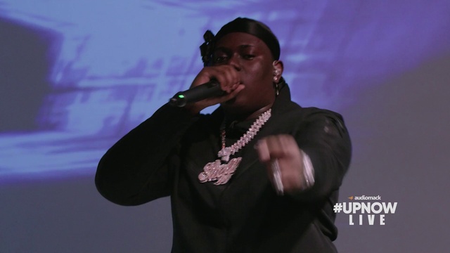 Video Reference: Glasses, Microphone, Arm, Purple, Music, Entertainment, Music artist, Musician, Performing arts, Audio equipment