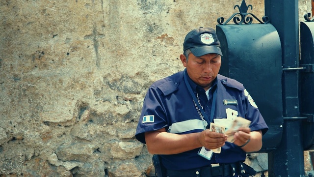 Video Reference: Military person, Sleeve, Military uniform, Cap, Security, Gesture, Glove, Baseball cap, Hat, Electric blue