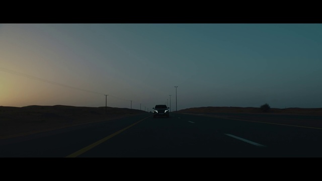 Video Reference: Sky, Vehicle, Car, Road surface, Asphalt, Motor vehicle, Mode of transport, Natural landscape, Tar, Horizon