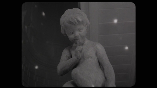 Video Reference: Jaw, Gesture, Flash photography, Sculpture, Style, Black-and-white, Chest, Art, Rectangle, Trunk