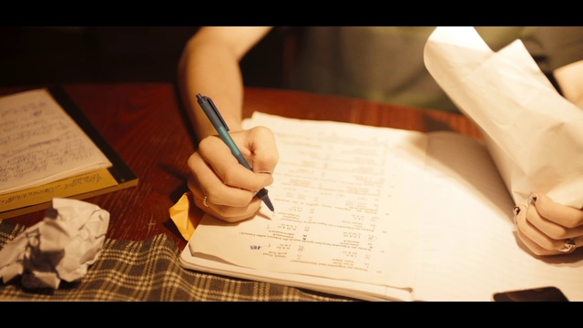 Video Reference: Hand, Handwriting, Gesture, Writing instrument accessory, Office supplies, Finger, Nail, Font, Thumb, Writing