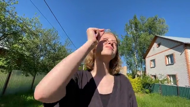 Video Reference: Hair, Sky, Shoulder, Vision care, Plant, Window, Neck, Tree, Gesture, Grass