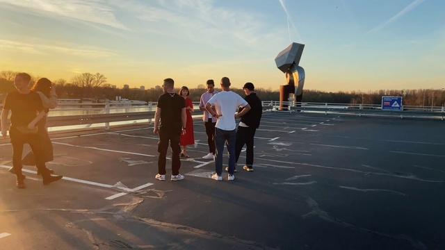 Video Reference: Sky, Cloud, Asphalt, Gesture, Road surface, Dusk, Horizon, Sunset, Leisure, Recreation