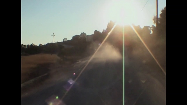 Video Reference: Sky, Atmosphere, Automotive lighting, Sunlight, Asphalt, Astronomical object, Sunrise, Road surface, Horizon, Dusk