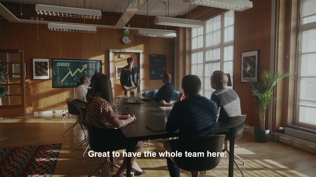Video Reference: Trousers, Furniture, Plant, Table, Building, Picture frame, Chair, Houseplant, Event, Suit