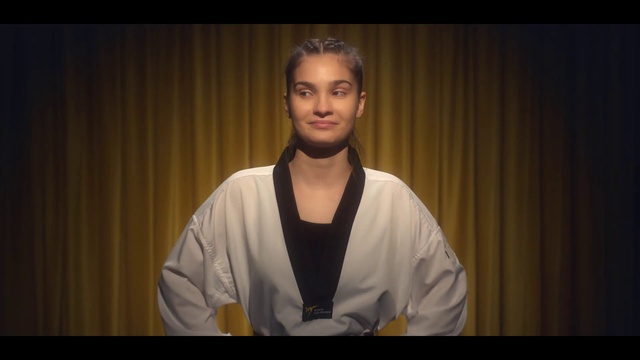 Video Reference: Flash photography, Neck, Curtain, Entertainment, Event, T-shirt, Public speaking, Audio equipment, White-collar worker, Fashion design