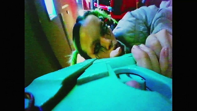 Video Reference: Green, Mouth, Organism, Gesture, Finger, Leaf vegetable, Event, Thumb, Fun, Room