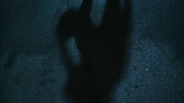 Video Reference: Gesture, Grey, Road surface, Tints and shades, Electric blue, Asphalt, Human leg, Darkness, Font, Pattern