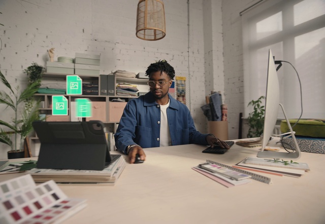 Video Reference: Shirt, Table, Desk, Houseplant, Interior design, Automotive design, Plant, Eyewear, Office equipment, Computer desk