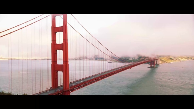 Video Reference: Water, Sky, Cloud, Suspension bridge, Horizon, Natural landscape, Dusk, Tree, Calm, Bridge