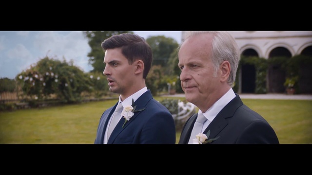 Video Reference: Tie, Coat, Dress shirt, Flash photography, Tree, Gesture, Suit, Happy, Collar, Plant