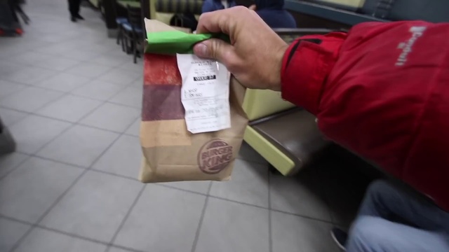 Video Reference: Outerwear, Handwriting, Wood, Flooring, Human leg, Event, Bag, Wrist, Thumb, Thigh