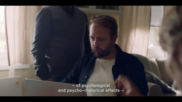 Video Reference: Mouth, Beard, Flash photography, Jaw, Neck, Gesture, Black hair, Font, Facial hair, Eyewear