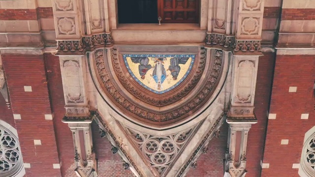 Video Reference: Wood, Wall, Symmetry, Building, Facade, Landmark, Art, Font, Window, Brickwork