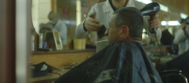 Video Reference: Forehead, Barber, Beauty salon, Ear, Personal grooming, Service, Mirror, Event, Hairdresser, Hair removal