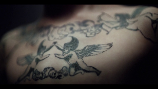 Video Reference: Sleeve, Font, Tattoo, Temporary tattoo, Elbow, Pattern, Human leg, Chest, Art, Wing