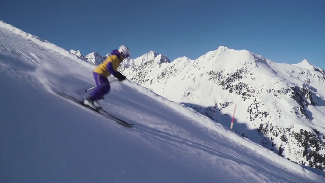 Video Reference: Sky, Mountain, Snow, Sports equipment, Slope, Winter sport, Outdoor recreation, Terrain, Headgear, Glacial landform