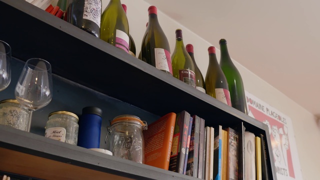 Video Reference: Bottle, Shelf, Drinkware, Shelving, Glass bottle, Bookcase, Alcoholic beverage, Barware, Material property, Drink