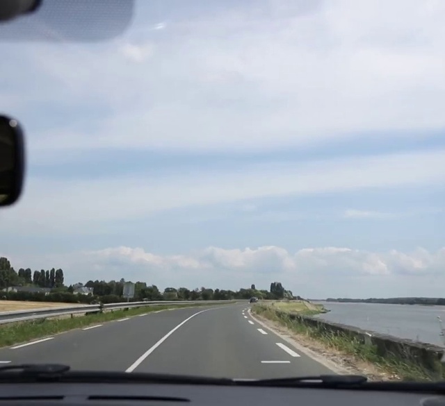 Video Reference: Cloud, Sky, Asphalt, Road surface, Natural landscape, Automotive mirror, Motor vehicle, Tar, Thoroughfare, Plant