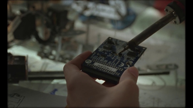 Video Reference: Hand, Circuit component, Electronic instrument, Audio equipment, Wrist, Font, Engineering, Office equipment, Electronic engineering, Hardware programmer