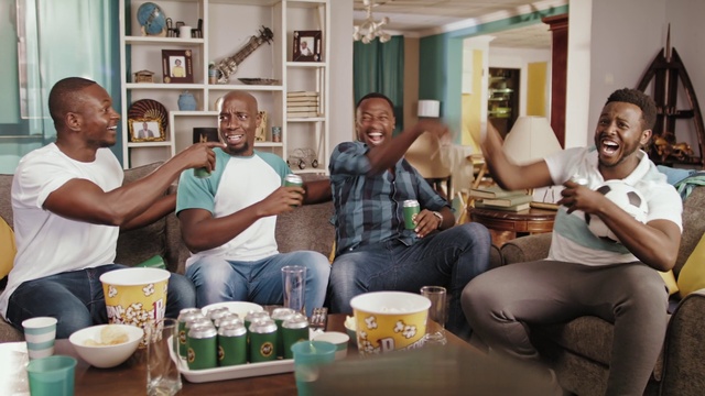 Video Reference: Smile, Jeans, Table, Arm, Tableware, Couch, Sharing, Comfort, Interior design, Picture frame