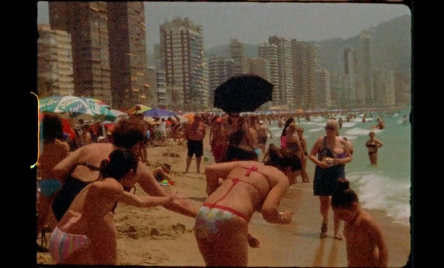 Video Reference: Photograph, Shorts, Building, People on beach, Human, Brassiere, Swimwear, Swimsuit top, Fun, Travel