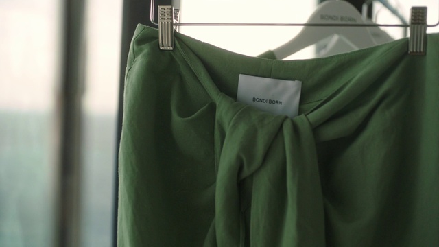 Video Reference: Sleeve, T-shirt, Dress, Clothes hanger, Grey, Collar, Formal wear, Fashion design, Pattern, Font